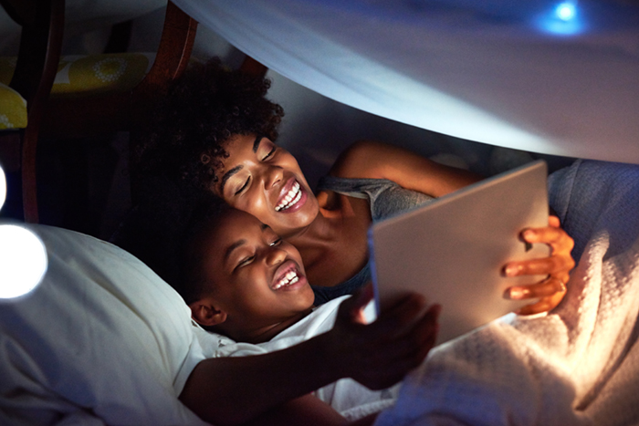 Mom and son with Ipad inside tent